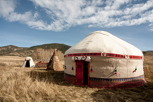 Yurt in a field representing eco-friendly stays
